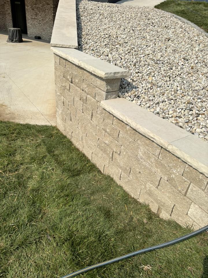 Retaining wall with drainage solution