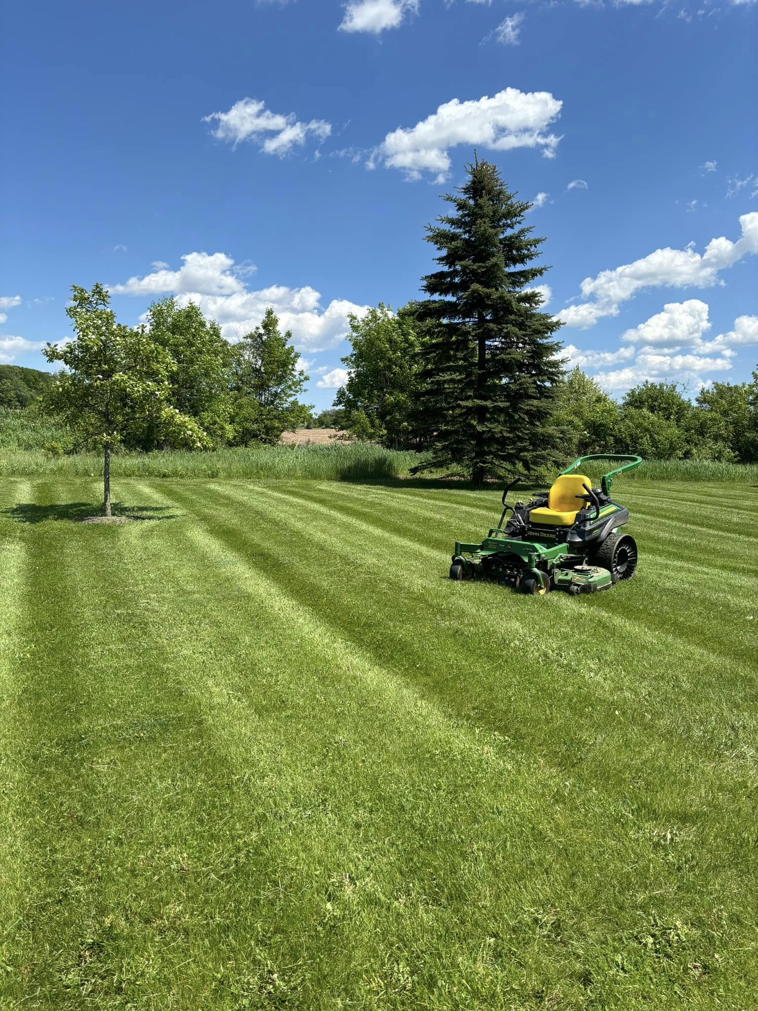 Maintained commercial property grounds with clean turf and landscape beds in Sheboygan County, Wisconsin