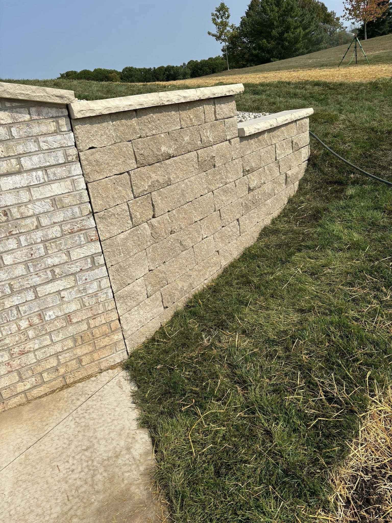 Completed retaining wall and landscaping by Beyond Landscaping in Sheboygan Falls, WI